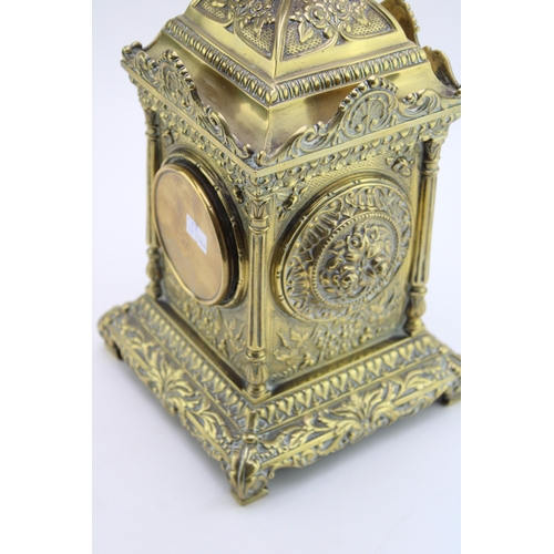 53 - A late 19th century French brass mantel clock, with roman numerals to the brass dial, with bird in f... 