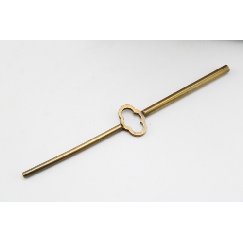 53 - A late 19th century French brass mantel clock, with roman numerals to the brass dial, with bird in f... 