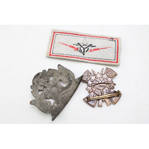 33 - A South African Memorable Order of Tin Hats (MOTH) an Overseas Dominions Cap Badge with another Avia... 