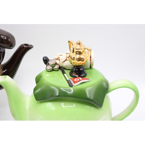 43 - Two 'golfing themed' novelty teapots to include green example with 19th hole flag and gilt trophy to... 