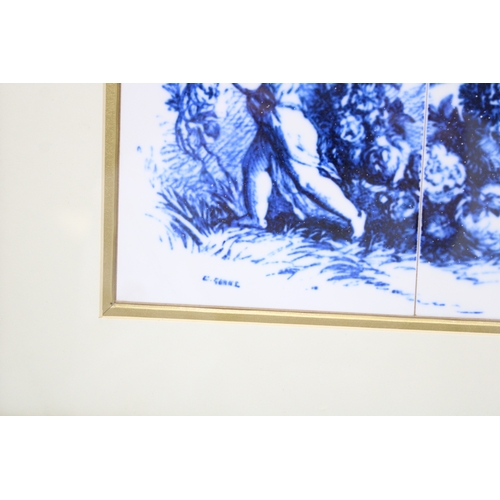 45 - A pair of Delft style tiles depicting two cherubs in gilt frame, 24cm x 17cm.