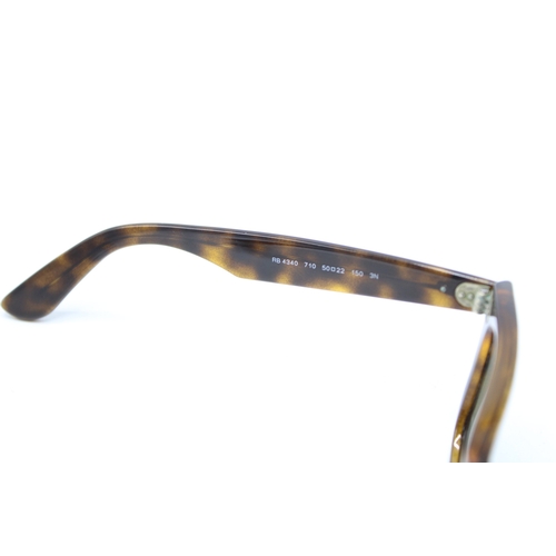 57 - A pair of Ray-Ban tortoiseshell Wayfarer sunglasses, made in Italy, RB 4340 50 22 150 3N.