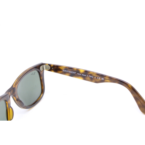 57 - A pair of Ray-Ban tortoiseshell Wayfarer sunglasses, made in Italy, RB 4340 50 22 150 3N.