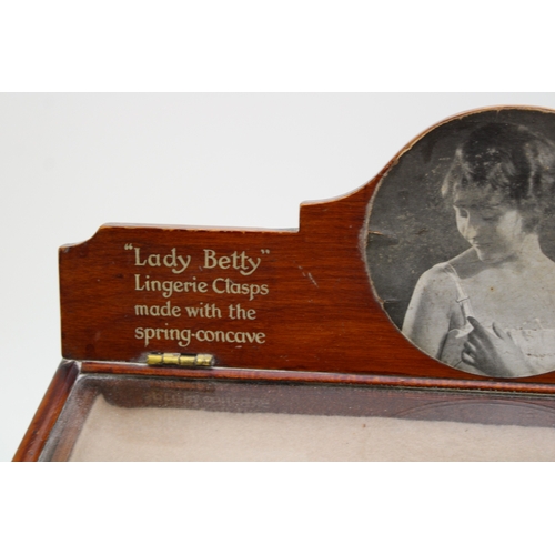 2 - An Edwardian lingerie counter top display case with glazed top and four long drawers for 