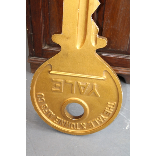 3 - An oversized Yale metal advertising sign in the form of a key, 78cm long.