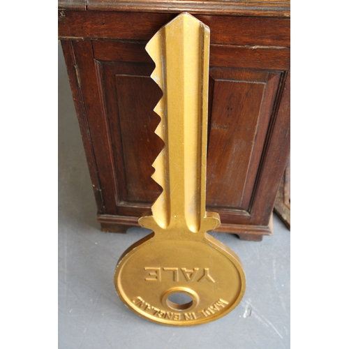 3 - An oversized Yale metal advertising sign in the form of a key, 78cm long.