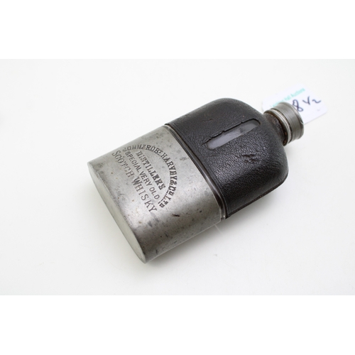 38 - John & Robt. Harvey & Co Scotch Whiskey Distillers advertising hip flask with stirrup cup, together ... 