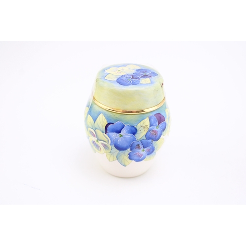 300 - Moorcroft Enamel lidded ginger jar in the Pansy design, 1998, 7.5cm tall.