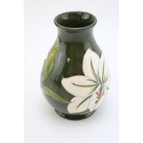 306 - Moorcroft 'Bermuda Lily' pattern vase, 13.5cm tall.