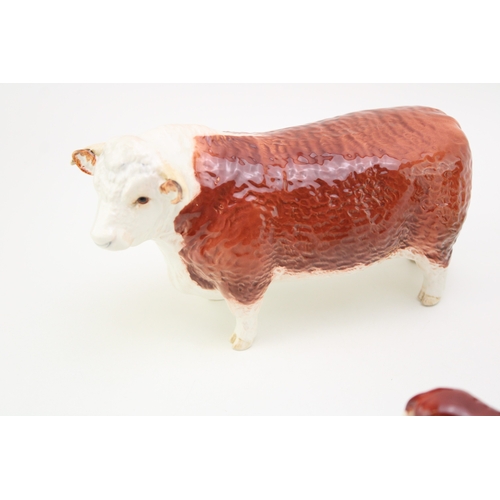 325 - Beswick Hereford Cattle family to include a bull, cow and calf (3).