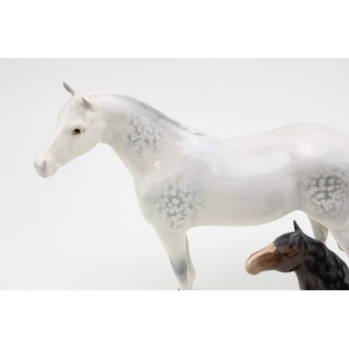 13 - Beswick to include a grey Thoroughbred Stallion 1772 , a brown head up pony and a brown head down, l... 