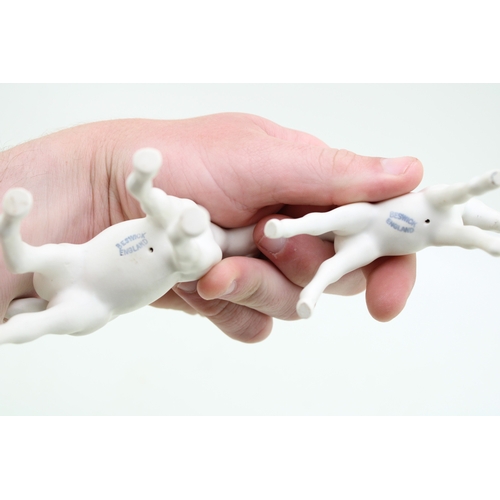 19 - Beswick stretched foal, facing left, 997, in matt white with one other (2).