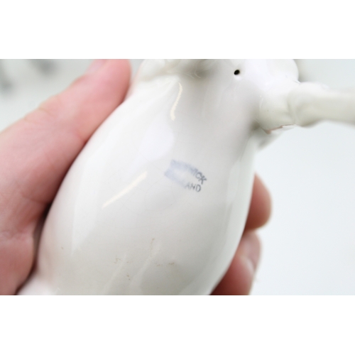 21 - Three Beswick horses to inclue a brown swishtail, an overpainted 'opaque' Arab Xayal and a black / b... 