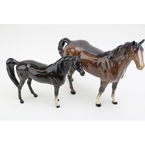 21 - Three Beswick horses to inclue a brown swishtail, an overpainted 'opaque' Arab Xayal and a black / b... 