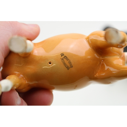 22 - Three Beswick horses to include an Arab Xayal, a brown head up pony and a palomino version (3).