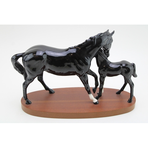 25 - Beswick Black Beauty and Foal in gloss, on wooden base.