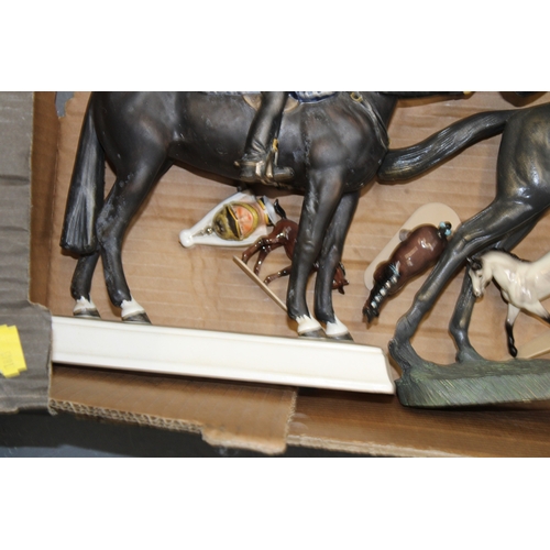 32 - A collection of pottery and similar horses to include a Goebel lifeguard (Af), and others (collectio... 