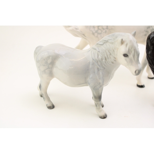 39 - Beswick horses to include a grey swishtail, a brown arab xayal and a grey Shetland (3).