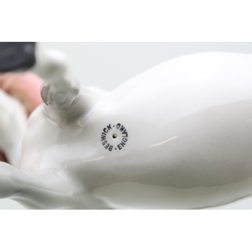 40 - Beswick horses to include a grey mare facing left and brown swishtail with an arab xayal (3).