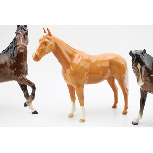 42 - Beswick horses to include a palomino imperial, a brown mare facing left and a brown spirit figure (3... 