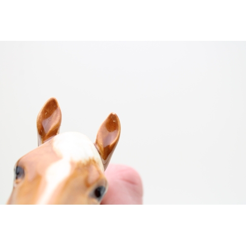 44 - Beswick Racehorse 1564 in Palomino (slight graze to one ear).