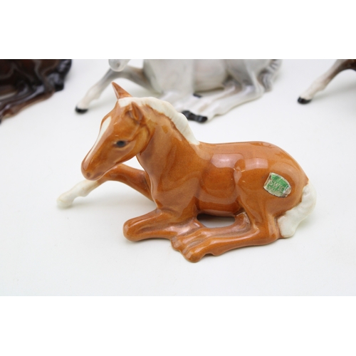 48 - A collection of eight Beswick foals of varying colours and models (8).