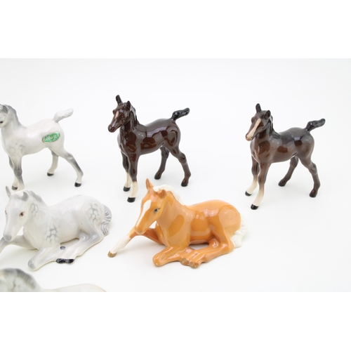 49 - A collection of eight Beswick foals of varying colours and models (8).