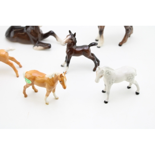 50 - A collection of eight Beswick foals of varying colours and models (8).