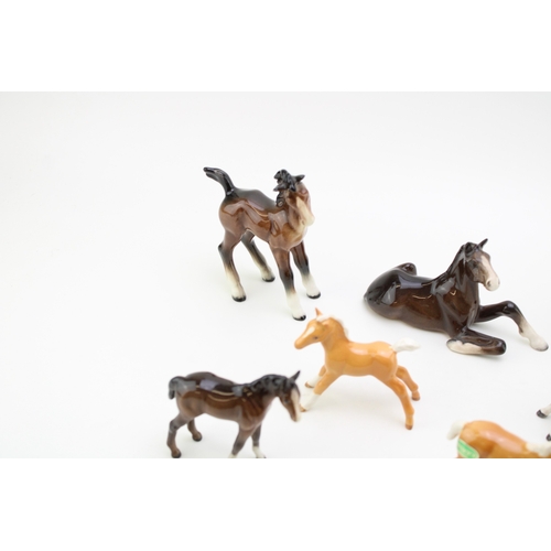 50 - A collection of eight Beswick foals of varying colours and models (8).