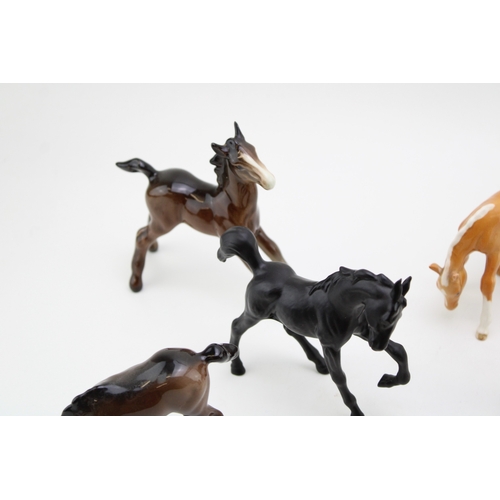 52 - A collection of eight Beswick foals of varying colours and models (8).