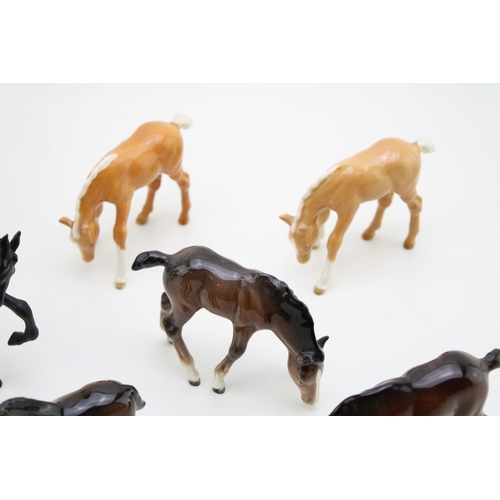 52 - A collection of eight Beswick foals of varying colours and models (8).
