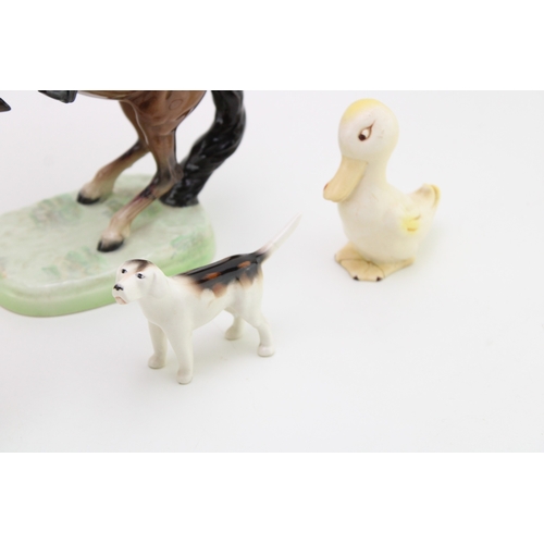8 - A collection of damaged Beswick to include a rearing huntsman 868, a comical duck and others (all af... 