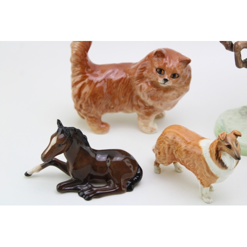 8 - A collection of damaged Beswick to include a rearing huntsman 868, a comical duck and others (all af... 