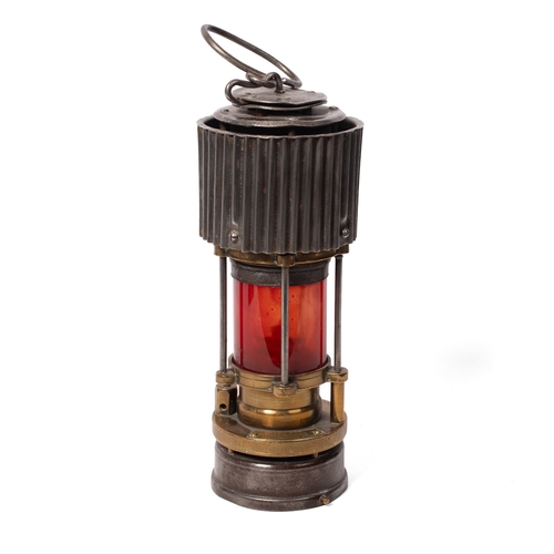 19 - A WWII ere Miners lamp, Patterson of Felling H.C.P, patent two with red glass, 31cm tall.