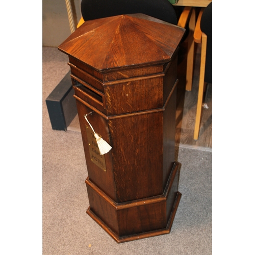 1 - An early 20th century oak country house postbox or letterbox, with later applied brass plaque, hexag... 
