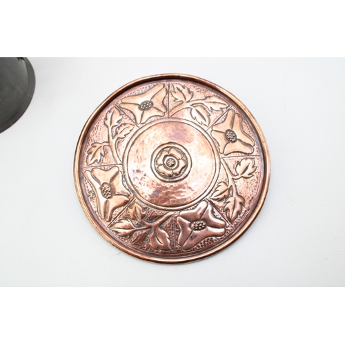 12 - A Keswick School of Industrial Arts copper repousse stand marked KSIA with a Liberty Tudric pewter t... 