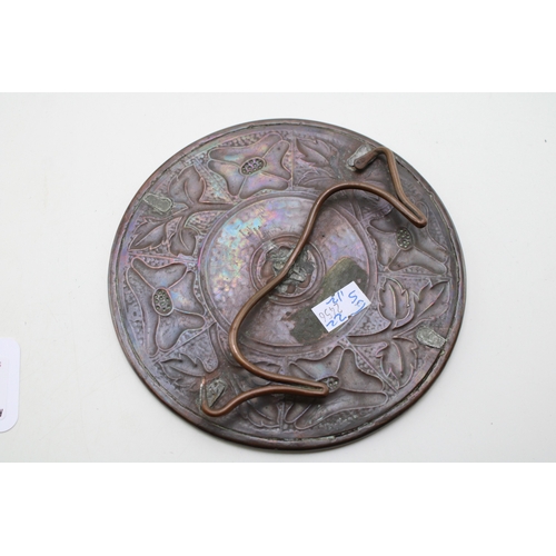12 - A Keswick School of Industrial Arts copper repousse stand marked KSIA with a Liberty Tudric pewter t... 