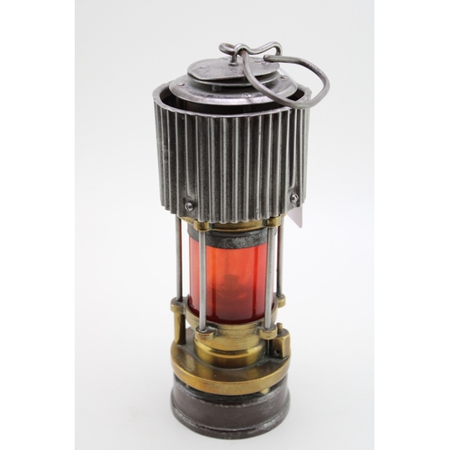 19 - A WWII ere Miners lamp, Patterson of Felling H.C.P, patent two with red glass, 31cm tall.