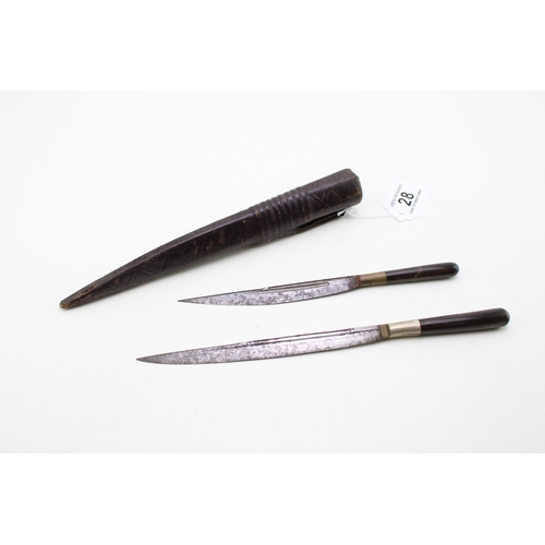 28 - A pair of horn or bone handled eating knives in a leather scabbard.