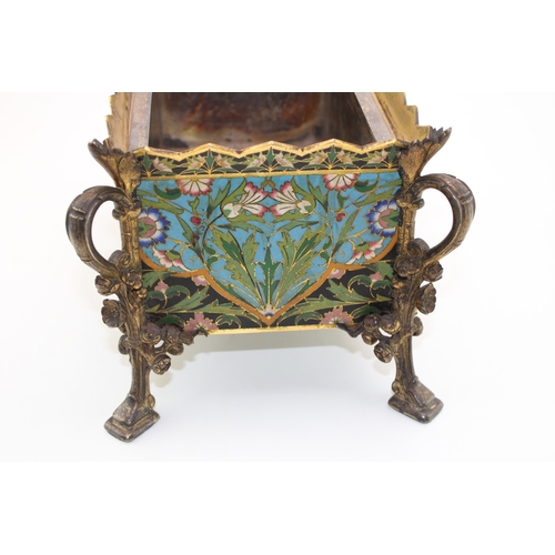 3 - An Elkington & Co cloisonne enamel planter with metal liner, raised on four feet with floral decorat... 