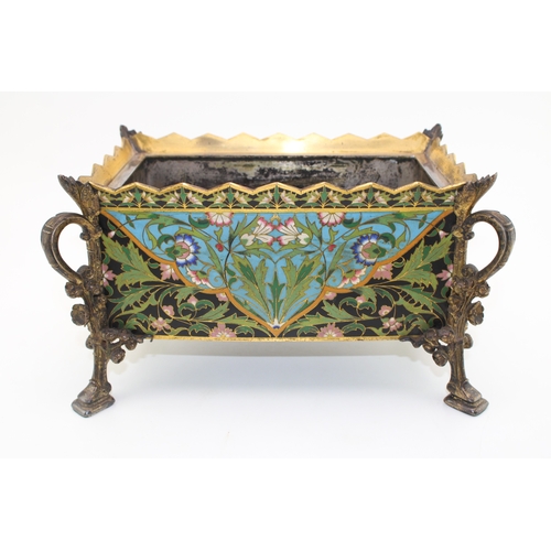 3 - An Elkington & Co cloisonne enamel planter with metal liner, raised on four feet with floral decorat... 