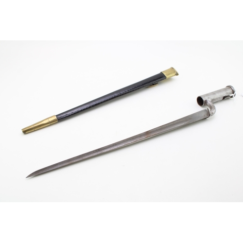 32 - A replica of a 19th century socket bayonet in a leather scabbard