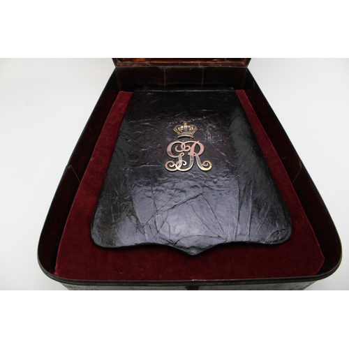 38 - A Georgian Napoleonic War era Cavalry black leather Sabretache bag with GR cypher & Crown contained ... 