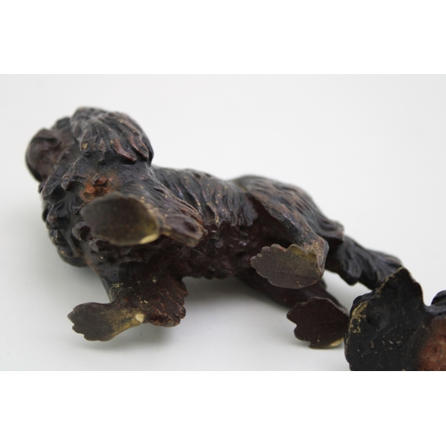 4 - A cold painted bronze figure of a Cavelier King Charles Spaniel, in standing pose, 5.5cm high, appar... 