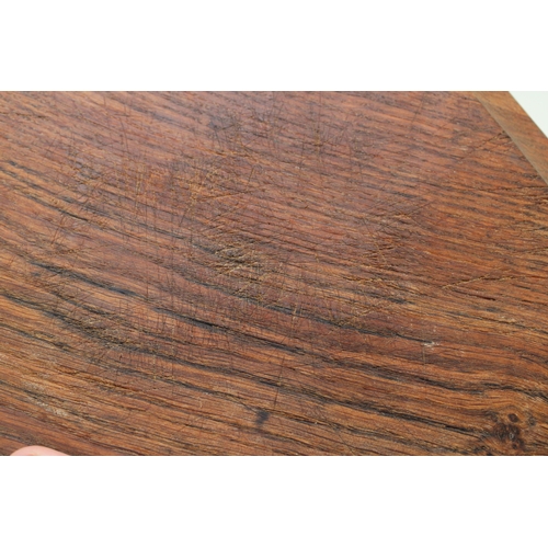 42 - Workshop of Robert 'Mouseman' Thompson, a carved oak breadboard, of octagonal form, with canted corn... 