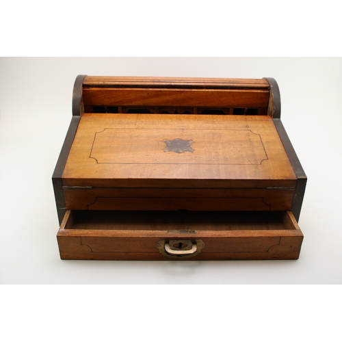 43 - A campaign camphor metamorphic lap desk, brass bound, the interior fitted with compartments, 46.5cm ... 