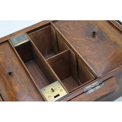 44 - An early 20th century cigar or cigarette oak locking humidor by Hallstaff & Hannaford 223 Regent Str... 