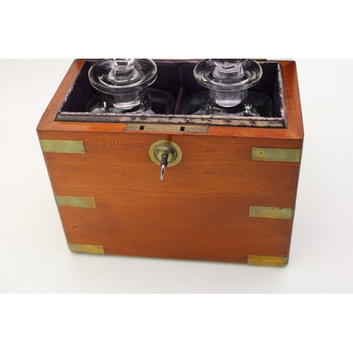 45 - A Victorian oak decanter box with brass banding, containing two cut glass decanter bottles, purple l... 