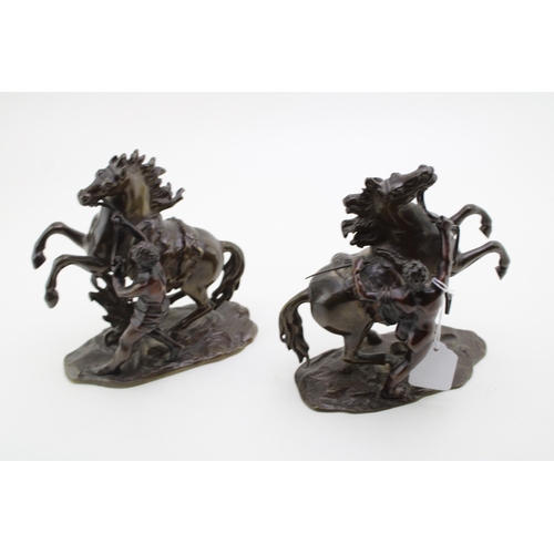 9 - A pair of 19th century bronzed spelter figures 'Horse Restrained by a Groom', modelled after the fam... 