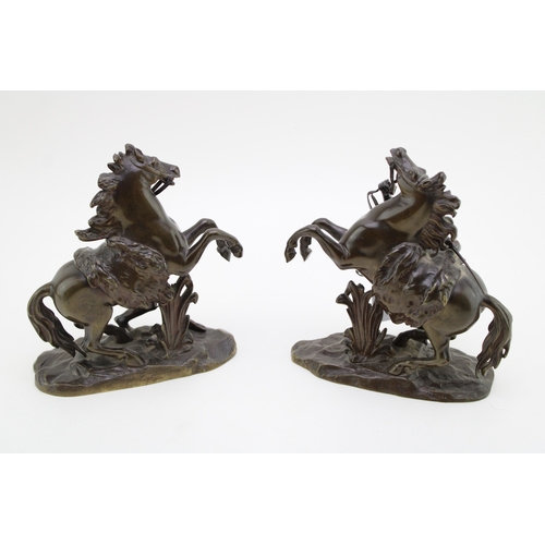 9 - A pair of 19th century bronzed spelter figures 'Horse Restrained by a Groom', modelled after the fam... 